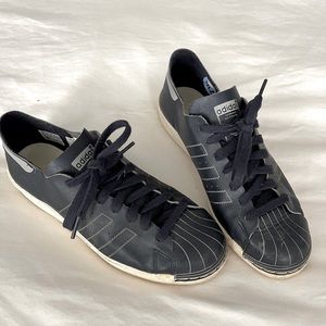 Adidas navy soft leather indoor shoes.